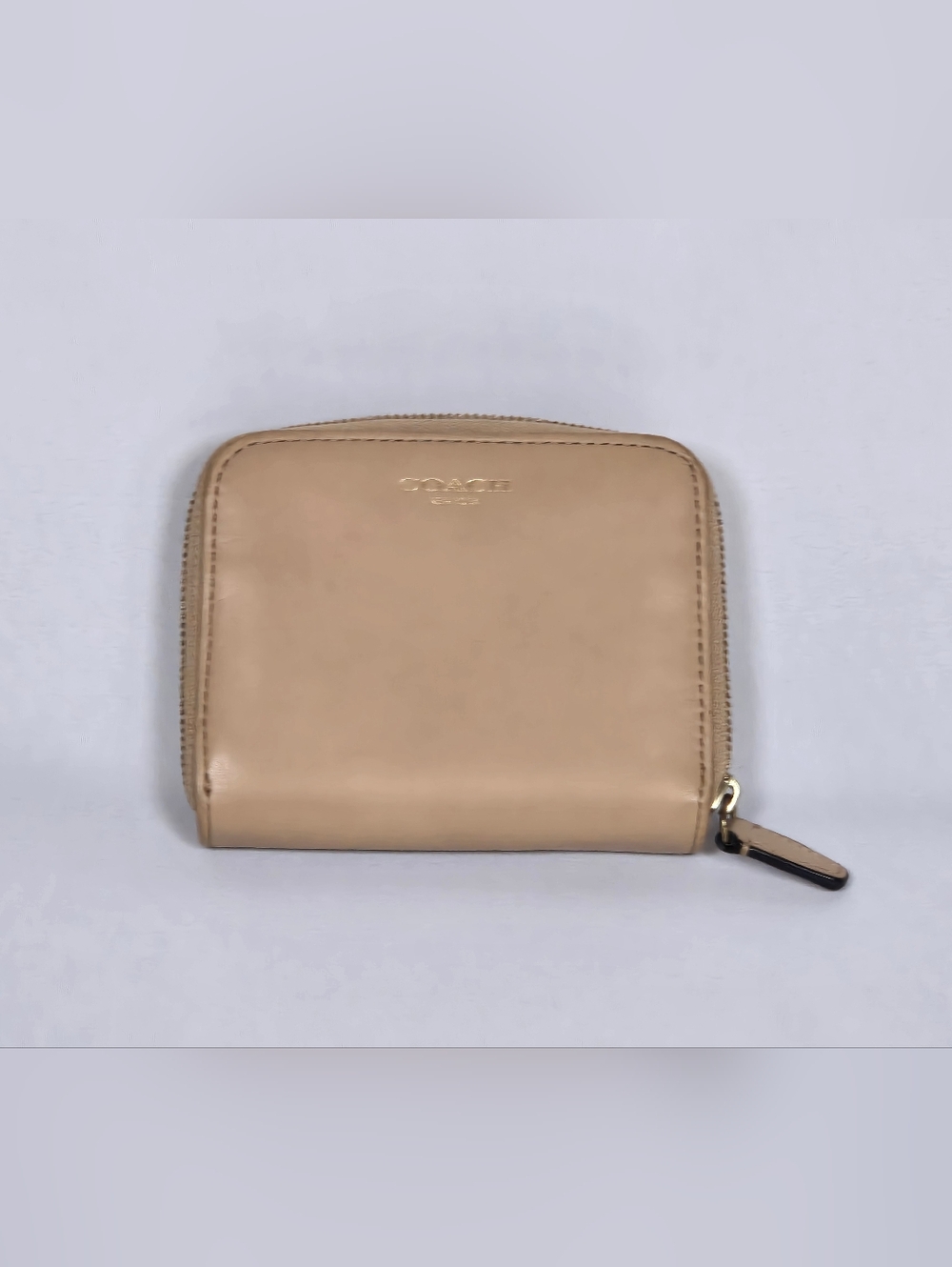 Coach leather zip wallet in beige